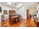 Spacious dining room with hardwood floors, large windows, and a beautiful china cabinet at 9267 Sw 91St Cir, Ocala, FL 34481