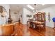 Elegant dining room featuring hardwood floors and a hutch at 9267 Sw 91St Cir, Ocala, FL 34481