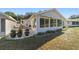 Exterior view showing the home's sunroom and patio area at 9267 Sw 91St Cir, Ocala, FL 34481