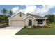 One-story home with a two-car garage and well-manicured lawn at 10021 Se 161St Lane Rd, Summerfield, FL 34491