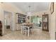 Bright dining room with access to screened porch at 10557 Sw 62Nd Ct, Ocala, FL 34476