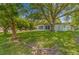 Spacious backyard with mature trees providing shade at 10557 Sw 62Nd Ct, Ocala, FL 34476