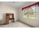 Bright bedroom featuring a built-in desk and window seat at 11462 Sw 82Nd Court Rd, Ocala, FL 34481