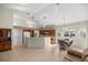 Open living space with vaulted ceiling and a view of the kitchen at 11462 Sw 82Nd Court Rd, Ocala, FL 34481