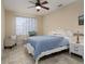 Bright bedroom featuring a comfortable bed and tiled floor at 12330 Nw 35Th St, Ocala, FL 34482