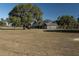 Single-story home with large oak tree and pasture views at 12330 Nw 35Th St, Ocala, FL 34482