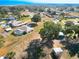 Aerial view of the house and neighborhood near lake at 14320 Se 96Th Ct, Summerfield, FL 34491