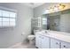 Bathroom with a vanity, toilet, and shower at 14320 Se 96Th Ct, Summerfield, FL 34491