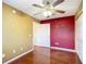 Another bedroom with wood floors and two-toned walls at 14320 Se 96Th Ct, Summerfield, FL 34491