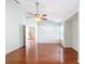 Large bedroom with wood floors and access to kitchen at 14320 Se 96Th Ct, Summerfield, FL 34491