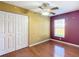 Bedroom with wood floors and two-toned walls at 14320 Se 96Th Ct, Summerfield, FL 34491