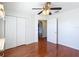 Bright bedroom with wood floors and double door closet at 14320 Se 96Th Ct, Summerfield, FL 34491