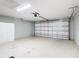 Bright and spacious garage interior with storage at 14320 Se 96Th Ct, Summerfield, FL 34491