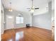 Living room with hardwood floors and ceiling fan at 14320 Se 96Th Ct, Summerfield, FL 34491