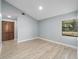 Spacious bedroom with light grey walls and wood-look floors at 15154 Sw 38Th Cir, Ocala, FL 34473