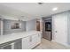 Modern kitchen with white cabinets, quartz countertops, and stainless steel appliances at 15154 Sw 38Th Cir, Ocala, FL 34473