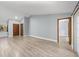 Open living room featuring light grey walls and wood-look floors at 15154 Sw 38Th Cir, Ocala, FL 34473