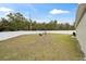 Large backyard with firepit and privacy fence at 16050 Sw 35Th Court Rd, Ocala, FL 34473