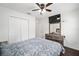 Comfortable bedroom with queen bed, double doors to closet, and ceiling fan at 16050 Sw 35Th Court Rd, Ocala, FL 34473