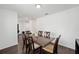 Bright dining room with dark wood table and six chairs at 16050 Sw 35Th Court Rd, Ocala, FL 34473