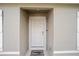 Modern front door with welcome mat at 16050 Sw 35Th Court Rd, Ocala, FL 34473