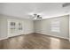 Well-lit bedroom with wood-look floors and sliding glass doors at 16689 Sw 22Nd Terrace Rd, Ocala, FL 34473