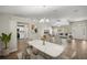 Elegant dining area with a marble table and modern lighting fixture at 16689 Sw 22Nd Terrace Rd, Ocala, FL 34473