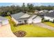 Single-Gathering home with a two-car garage and landscaped yard at 17920 Sw 66Th Pl, Dunnellon, FL 34432