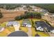 Aerial view of a residential community featuring upscale homes and pools at 17920 Sw 66Th Pl, Dunnellon, FL 34432