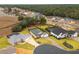 Aerial view of a luxury community with houses, pools, and lush landscaping at 17920 Sw 66Th Pl, Dunnellon, FL 34432