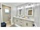 Modern bathroom with double vanity and updated fixtures at 17920 Sw 66Th Pl, Dunnellon, FL 34432