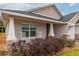 Front porch with rocking chairs and landscaping at 17920 Sw 66Th Pl, Dunnellon, FL 34432