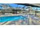 Enclosed pool and patio area with seating at 17920 Sw 66Th Pl, Dunnellon, FL 34432