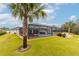 Relaxing screened-in pool area with lounge chairs and palm trees at 17920 Sw 66Th Pl, Dunnellon, FL 34432