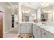 Bathroom with double vanity and marble countertop at 1918 Walden Way, The Villages, FL 32162