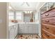 Large bathroom with double vanity and corner sink at 1918 Walden Way, The Villages, FL 32162