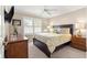 Guest bedroom with king-size bed and neutral decor at 1918 Walden Way, The Villages, FL 32162