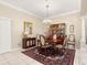 Elegant dining room featuring a china cabinet and rug at 1918 Walden Way, The Villages, FL 32162