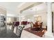 Bright dining room with chandelier and hardwood floors at 1918 Walden Way, The Villages, FL 32162