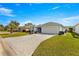 Single-story home with paved driveway and landscaped yard at 1918 Walden Way, The Villages, FL 32162