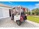 White Club Car golf cart parked in driveway at 1918 Walden Way, The Villages, FL 32162