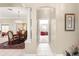 Elegant hallway leading to dining and living areas at 1918 Walden Way, The Villages, FL 32162