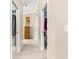 Home hallway with two large closets and a dresser at 1918 Walden Way, The Villages, FL 32162