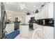 Spacious kitchen with white cabinets and granite countertops at 1918 Walden Way, The Villages, FL 32162