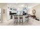 Modern kitchen island with seating and granite top at 1918 Walden Way, The Villages, FL 32162