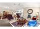 Relaxing living room featuring a large mirror and area rug at 1918 Walden Way, The Villages, FL 32162