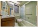 Retro bathroom with shower/tub, vanity, and green tile at 1981 Se 54Th Ter, Ocala, FL 34480