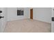 Simple bedroom with beige carpet and a window at 1981 Se 54Th Ter, Ocala, FL 34480