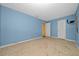 Spacious bedroom with light blue walls and wood-look flooring at 1981 Se 54Th Ter, Ocala, FL 34480