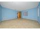 Blue bedroom with tiled floors and ample natural light at 1981 Se 54Th Ter, Ocala, FL 34480